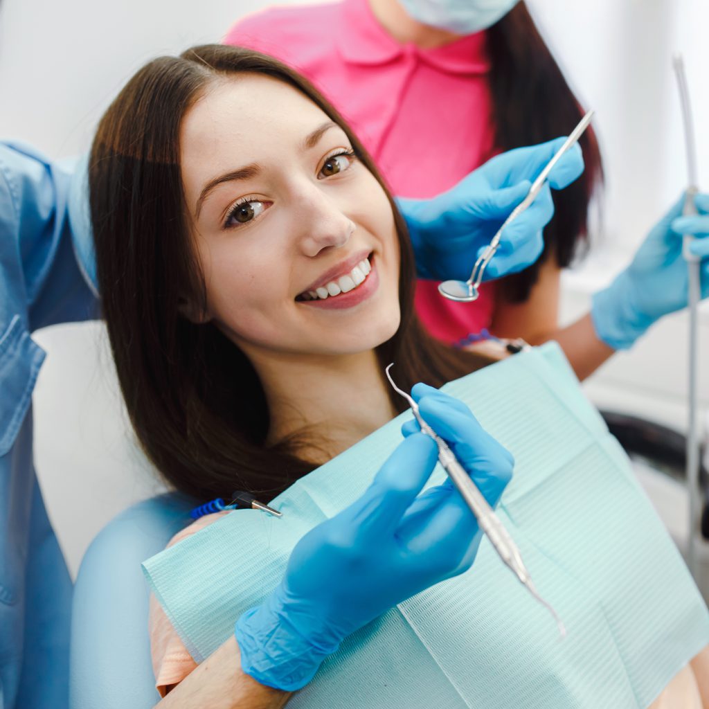 smiling-woman-dentist-chair (1)
